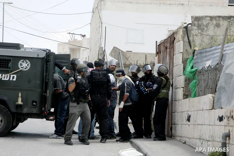 Israeli riot and undercover policemen take position during clashes with Palestinian protesters in the east Jerusalem Arab neighborhood of Issawiya on May 15, 2011 while heavy clashes broke out near Ramallah in the West B...