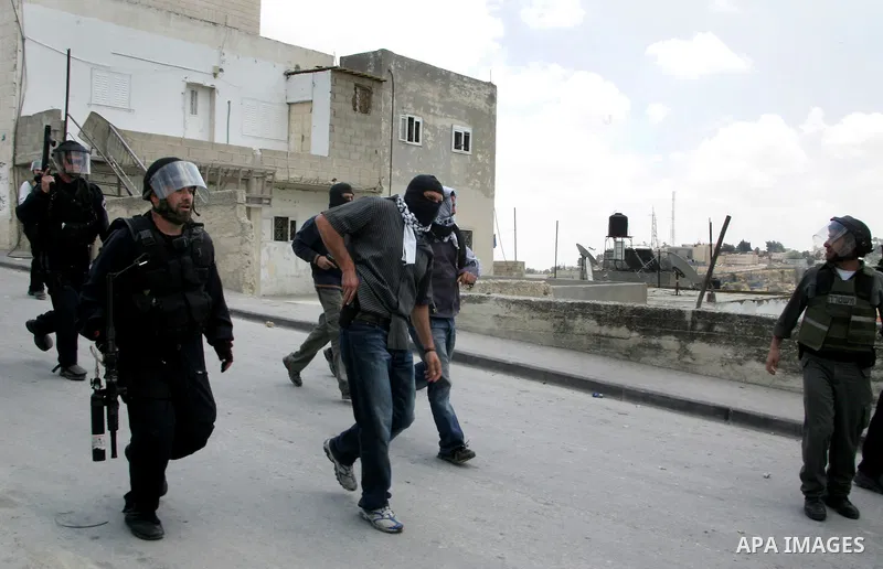 Israeli riot and undercover policemen take position during clashes with Palestinian protesters in the east Jerusalem Arab neighborhood of Issawiya on May 15, 2011 while heavy clashes broke out near Ramallah in the West B...