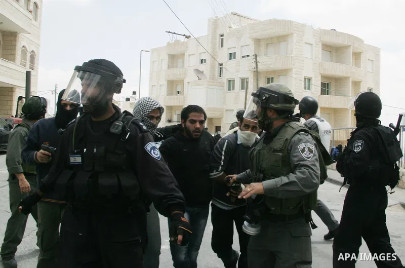 Israeli riot and undercover policemen take position during clashes with Palestinian protesters in the east Jerusalem Arab neighborhood of Issawiya on May 15, 2011 while heavy clashes broke out near Ramallah in the West B...