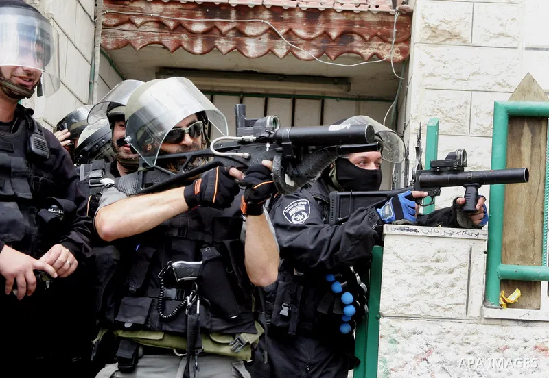 Israeli riot and undercover policemen take position during clashes with Palestinian protesters in the east Jerusalem Arab neighborhood of Issawiya on May 15, 2011 while heavy clashes broke out near Ramallah in the West B...