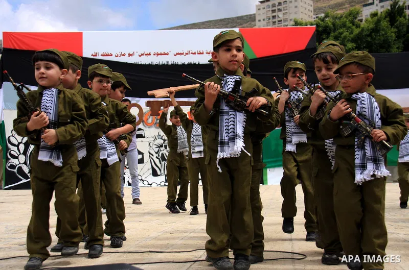 Palestinian children, some of them holding symbolic keys representing the keys to their homes snatched when the state of Israel was created, attend a rally to mark the day of "nakba" or the catastrophe on May 15, 2011 in...