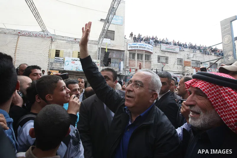 Palestinian Prime Minister, Salam Fayyad takes part in a rally marking the 63rd anniversary of 'Nakba', Arabic for 'Catastrophe', the term used to mark the events leading to Israel's founding in 1948 in the West Bank cit...