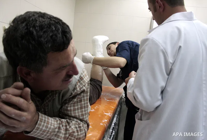 A Palestinian photographer Najeh Hashlamoun receive treatment at a hospital after he wounded when Israeli troops opened fire during confrontations in the restive West Bank city of Hebron as heavy clashes broke out near R...