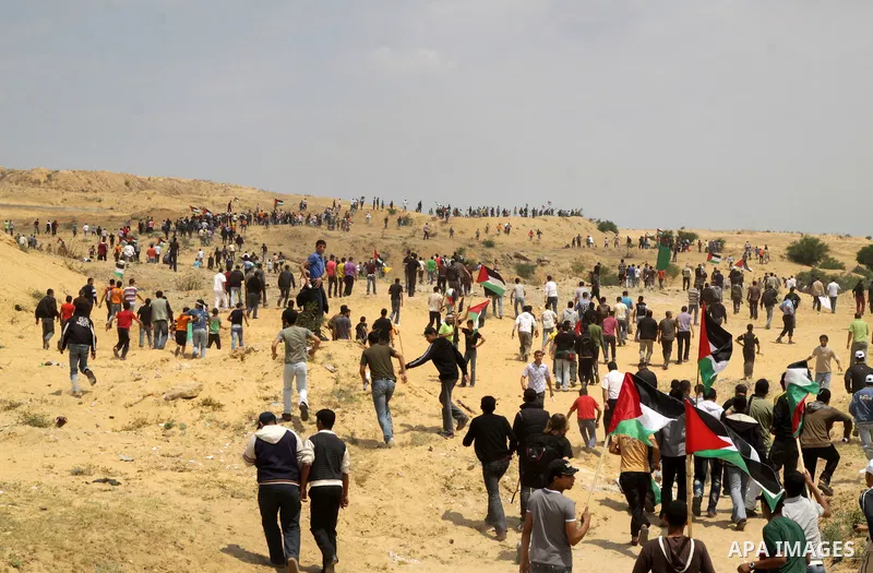 Palestinian protesters march towards the Erez border crossing in the northern Gaza Strip on May 15, 2011 to mark the "Nakba" or "Catastrophe" anniversary of Israel's creation in 1948, as a result of which more than 760,0...