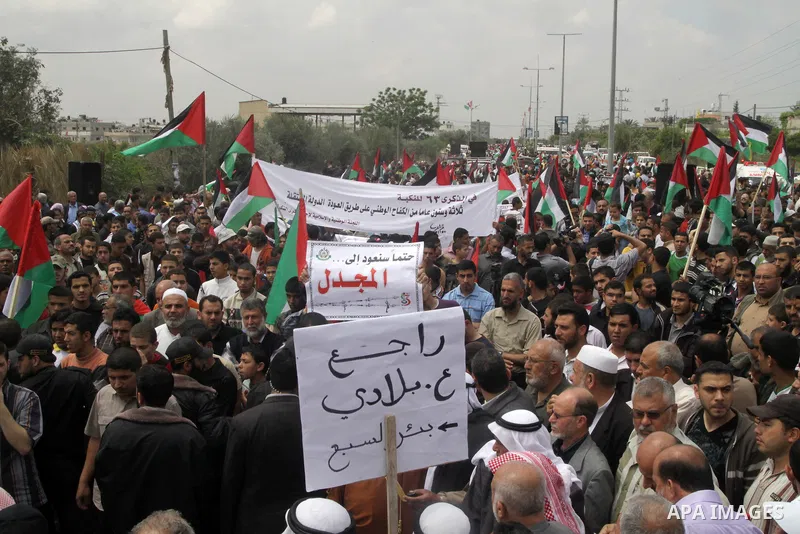 Palestinian protesters gather clsoe to the Erez crossing in the northern Gaza Strip, on May 15, 2011, as people gathered to mark the "nakbah" or "catastrophe" anniversary of Israel's creation in 1948, as a result of whic...