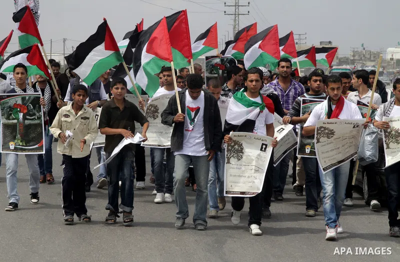 Palestinian protesters gather clsoe to the Erez crossing in the northern Gaza Strip, on May 15, 2011, as people gathered to mark the "nakbah" or "catastrophe" anniversary of Israel's creation in 1948, as a result of whic...