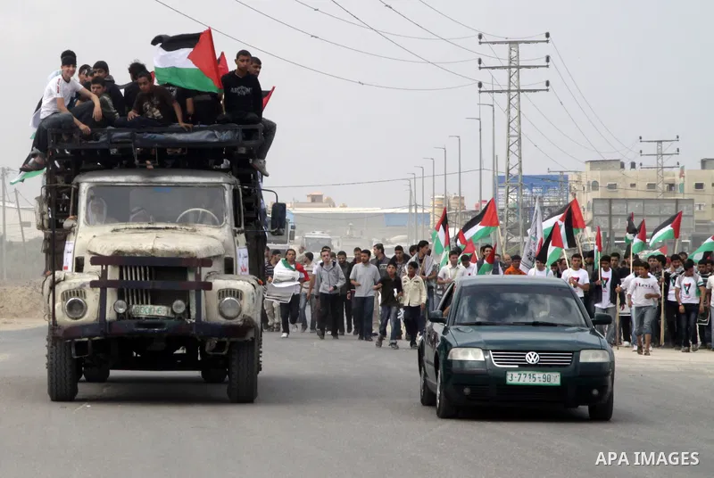 Palestinian protesters gather clsoe to the Erez crossing in the northern Gaza Strip, on May 15, 2011, as people gathered to mark the "nakbah" or "catastrophe" anniversary of Israel's creation in 1948, as a result of whic...