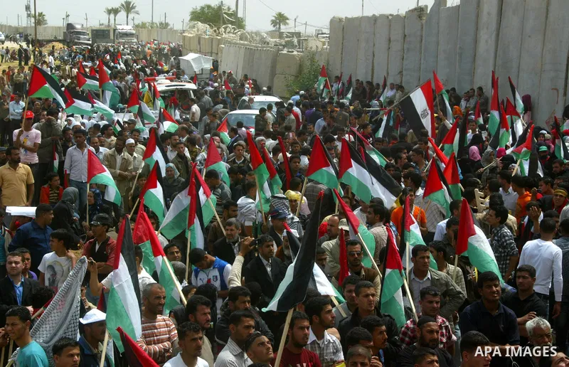 Palestinians rally along the Rafah border terminal between Egypt and the southern Gaza Strip, on May 15, 2011, during a gathering to mark the 63th anniversary of the "Nakba" (catastrophe). Nakba means "catastrophe" in re...