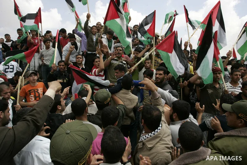 Palestinians rally along the Rafah border terminal between Egypt and the southern Gaza Strip, on May 15, 2011, during a gathering to mark the 63th anniversary of the "Nakba" (catastrophe). Nakba means "catastrophe" in re...