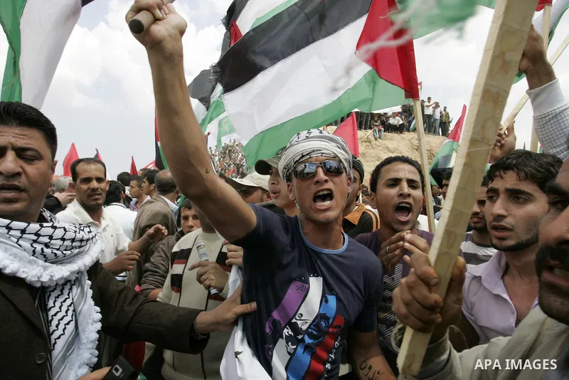 Palestinians rally along the Rafah border terminal between Egypt and the southern Gaza Strip, on May 15, 2011, during a gathering to mark the 63th anniversary of the "Nakba" (catastrophe). Nakba means "catastrophe" in re...
