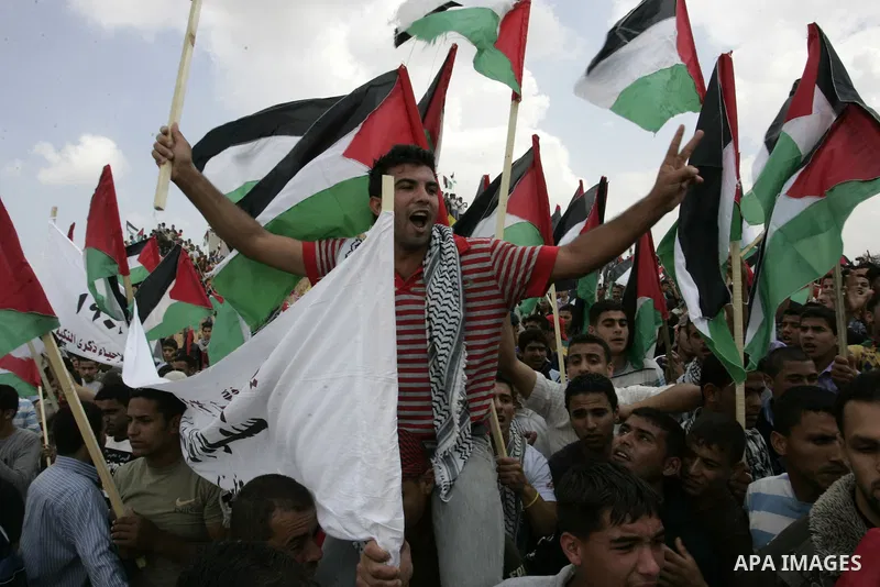 Palestinians rally along the Rafah border terminal between Egypt and the southern Gaza Strip, on May 15, 2011, during a gathering to mark the 63th anniversary of the "Nakba" (catastrophe). Nakba means "catastrophe" in re...