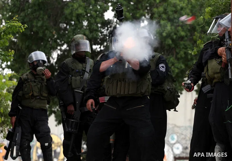 Israeli soldiers fire tear gas canisters during clashes with stone throwers at the Israeli manned Qalandia checkpoint between Jerusalem and the West Bank city of Ramallah on May 15, 2011. Palestinians across the Israeli...