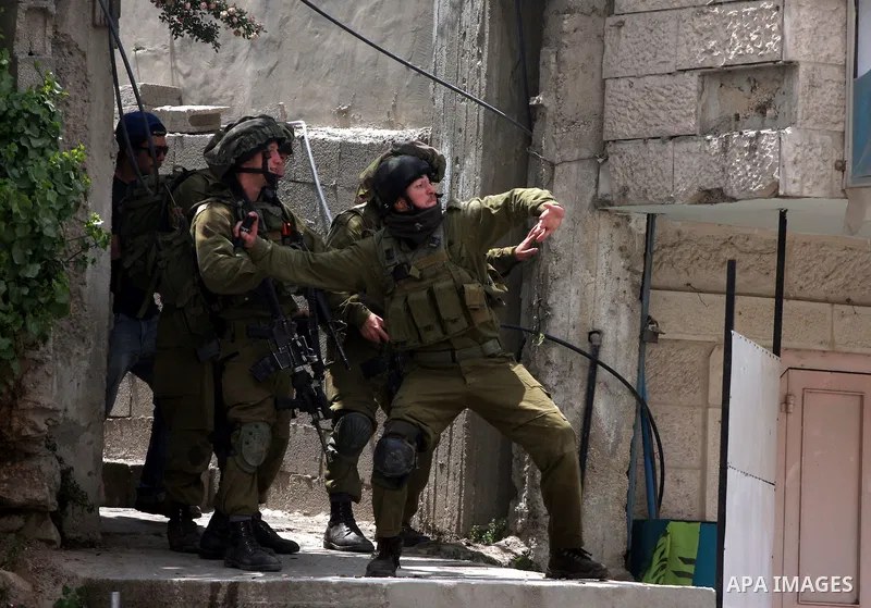 Israeli soldiers fire tear gas canisters during clashes with stone throwers at the Israeli manned Qalandia checkpoint between Jerusalem and the West Bank city of Ramallah on May 15, 2011. Palestinians across the Israeli...