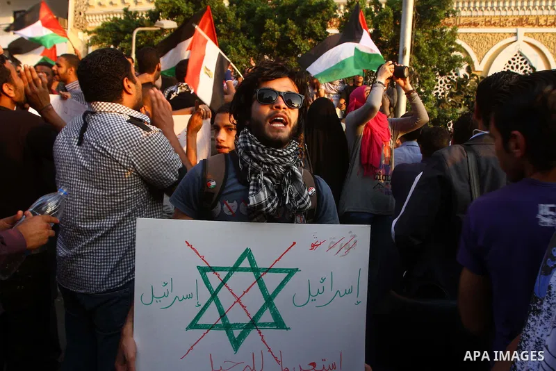 Egyptian protesters take part in a protest in front of the Israeli embassy in Cairo on May 15, 2011 in solidarity with Palestinians who mourned the "nakbah" anniversary of Israel's creation in 1948, as a result of which...