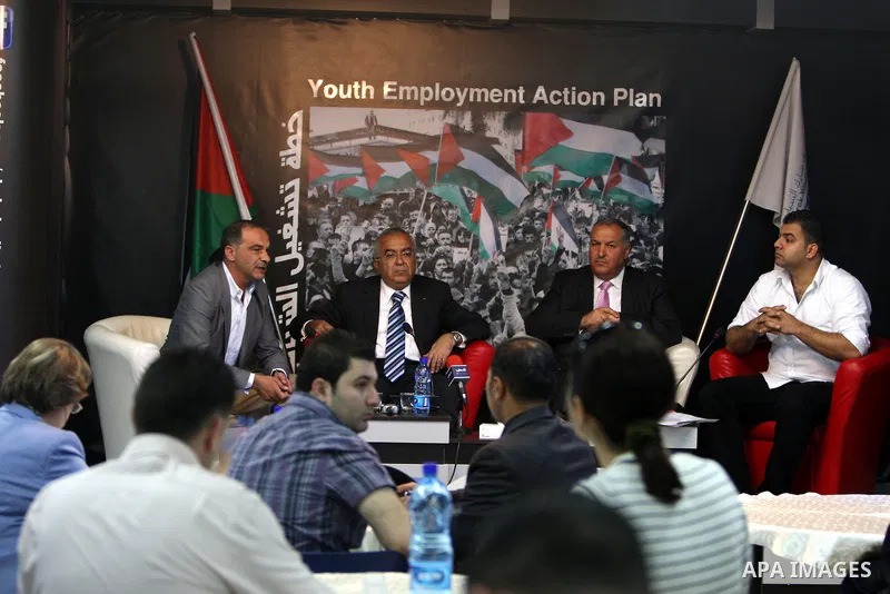 Palestinian Prime Minister, Salam Fayyad attends a ceremony for the launching a plan to work Palestinian youths, in the West Bank city of Ramallah on May 16, 2011. Photo by Mustafa Abu Dayeh