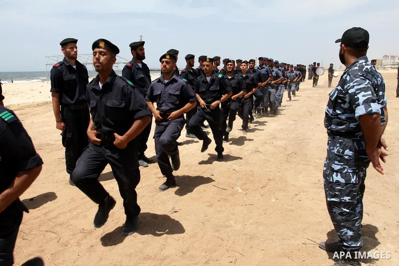 Palestinian Hamas security forces march during a ceremony to honor the Palestinian policemen in Gaza city on May 19, 2011, in the occasion of recognition of the Palestinian Police College. Photo by Mohammed Asad