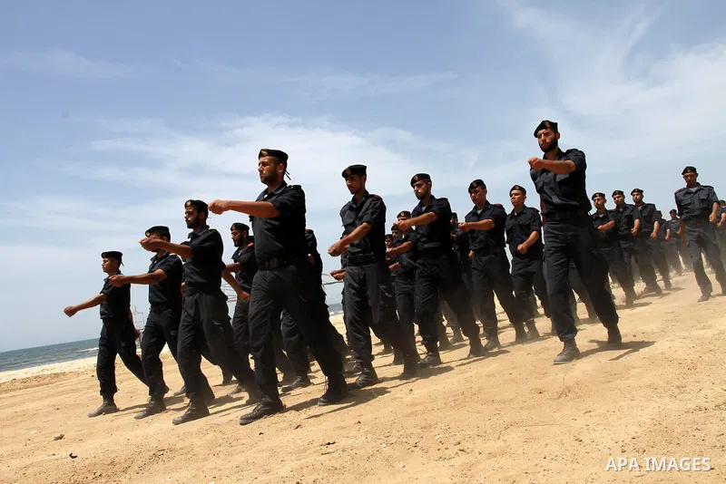 Palestinian Hamas security forces march during a ceremony to honor the Palestinian policemen in Gaza city on May 19, 2011, in the occasion of recognition of the Palestinian Police College. Photo by Mohammed Asad