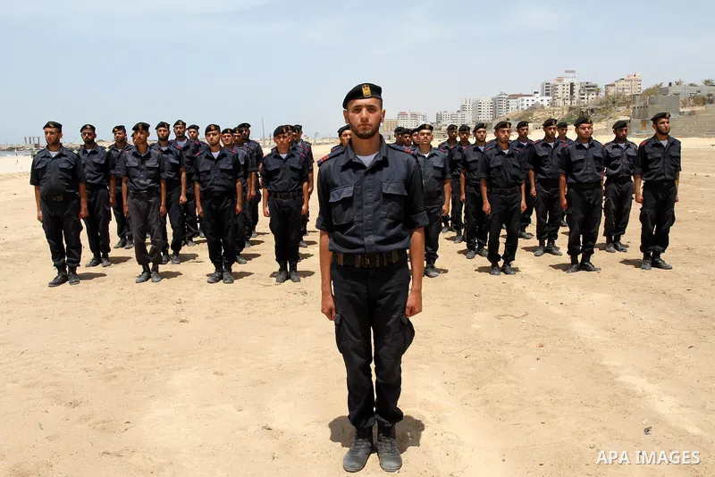 Palestinian Hamas security forces march during a ceremony to honor the Palestinian policemen in Gaza city on May 19, 2011, in the occasion of recognition of the Palestinian Police College. Photo by Mohammed Asad