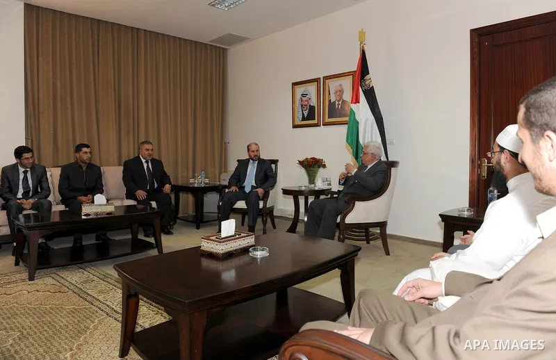 Palestinian President Mahmoud Abbas (Abu Mazen) during a meeting with the memorizers of the Holy Quran who won in advance centers in the international competitions in the West Bank city of Ramallah on May 19, 2011. Photo...