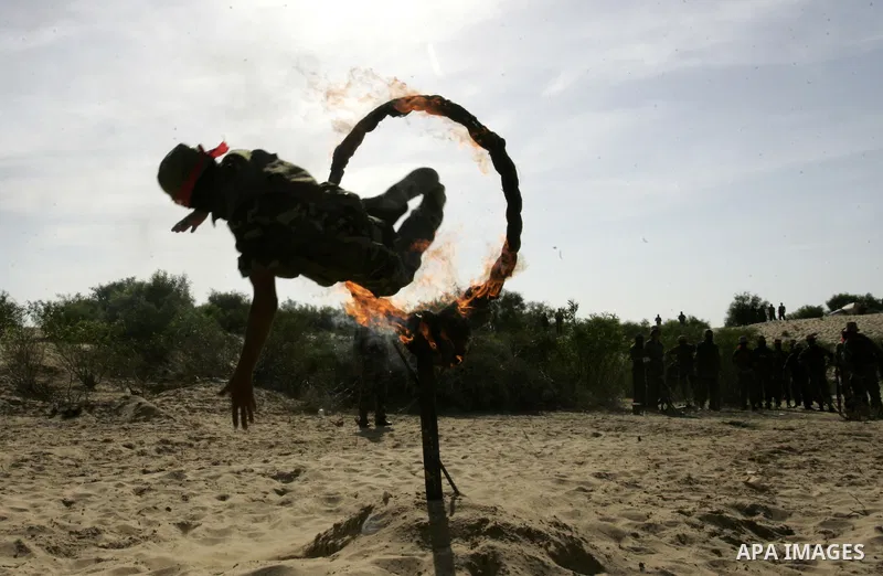 Militants with the Democratic Front for the Liberation of Palestine (DFLP) take part in a military training session in the southern Gaza Strip town of Khan Yunis on May 19, 2011. Photo by Abed Rahim Khatib