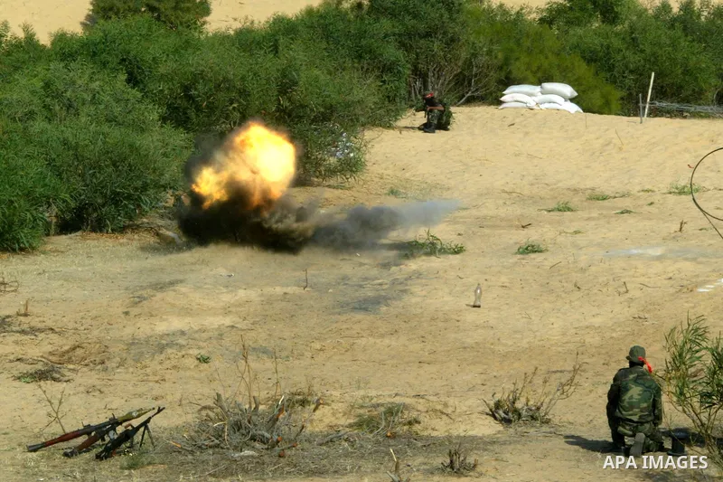 Militants with the Democratic Front for the Liberation of Palestine (DFLP) take part in a military training session in the southern Gaza Strip town of Khan Yunis on May 19, 2011. Photo by Abed Rahim Khatib