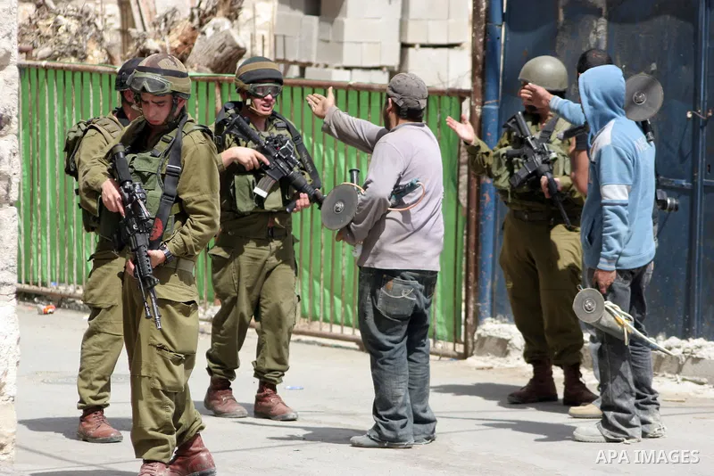 Israeli soldiers stand guard during clashes with Palestinian youths following a demonstration in the West Bank village of Al-khader near Bethlehem, Friday, May 20, 2011. President Barack Obama on Thursday finally uttered...
