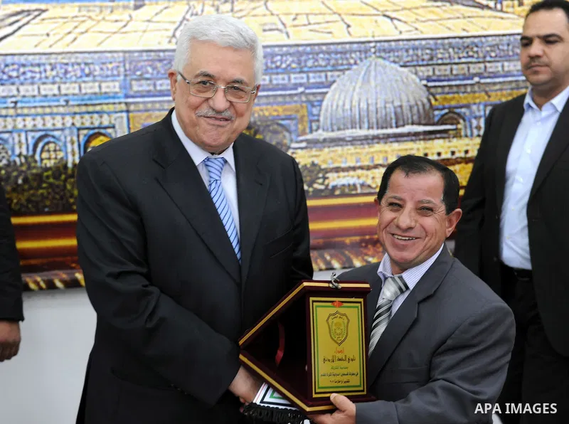 Palestinian President Mahmoud Abbas (Abu Mazen) during a meeting with sports media delegation and Albaqaa football team in the West Bank city of Ramallah on May 20, 2011. Photo by Thaer Ganaim