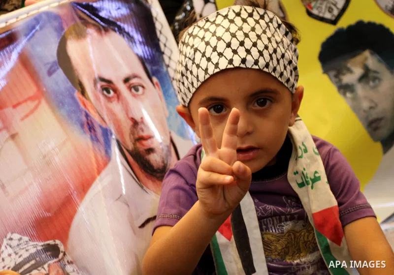 Palestinian children during a rally, at the headquarters of the Red cross calling for the release of Palestinian prisoners from Israeli jails, in Gaza city on May 23, 2011. Photo by Mohammed Asad