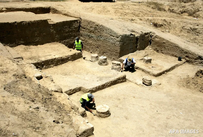 Palestinian workers excavate for ancient artifacts recently discovered near the Egyptian border town of Rafah are displayed by the Hamas-run ministry of tourism and antiquities in the southern Gaza Strip on May 25, 2011....