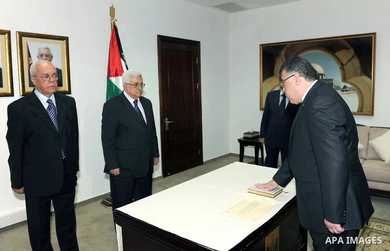 Nazmi Al Hazouri swears in front of Palestinian President Mahmoud Abbas (Abu Mazen) and Ambassador of Palestine to Kurdistan in the west bank City of Ramallah on May 26, 2011. photo by Thaer Ganaim