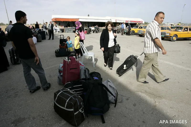 Palestinians wait to cross into Egypt through the Rafah border terminal in the southern Gaza Strip on May 26, 2011, a day after the official MENA news agency reported that Egypt will open the crossing on a daily basis st...