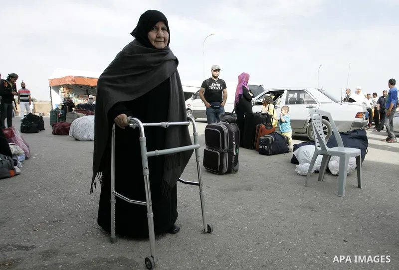 Palestinian women wait to cross into Egypt through the Rafah border terminal in the southern Gaza Strip on May 26, 2011, a day after the official MENA news agency reported that Egypt will open the crossing on a daily bas...