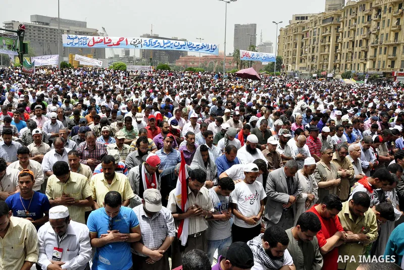 Egyptian protesters attend the weekly Muslim Friday prayers at Tahrir Square in Cairo, Egypt Friday, May 27, 2011. Thousands of protesters poured into downtown Cairo's Tahrir Square Friday for what they called a 'second...