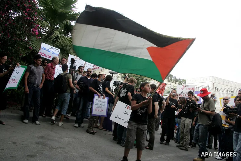 Left wing Israelis, Palestinians and international activists protest before the dedication ceremony for the Jewish neighborhood of Maale Hazeitim, inside the east Jerusalem area of Ras el Amud, Friday, May 27, 2011. Duri...