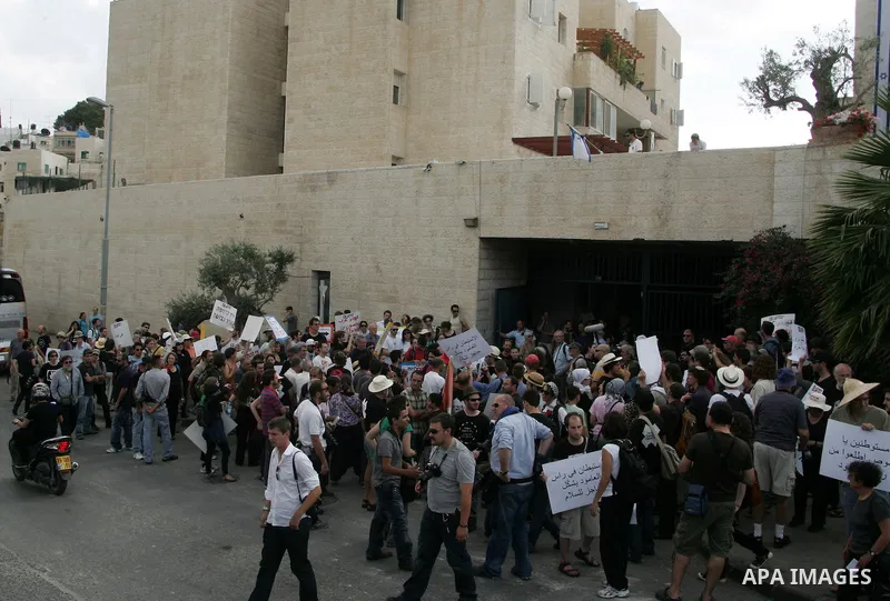 Left wing Israelis, Palestinians and international activists protest before the dedication ceremony for the Jewish neighborhood of Maale Hazeitim, inside the east Jerusalem area of Ras el Amud, Friday, May 27, 2011. Duri...