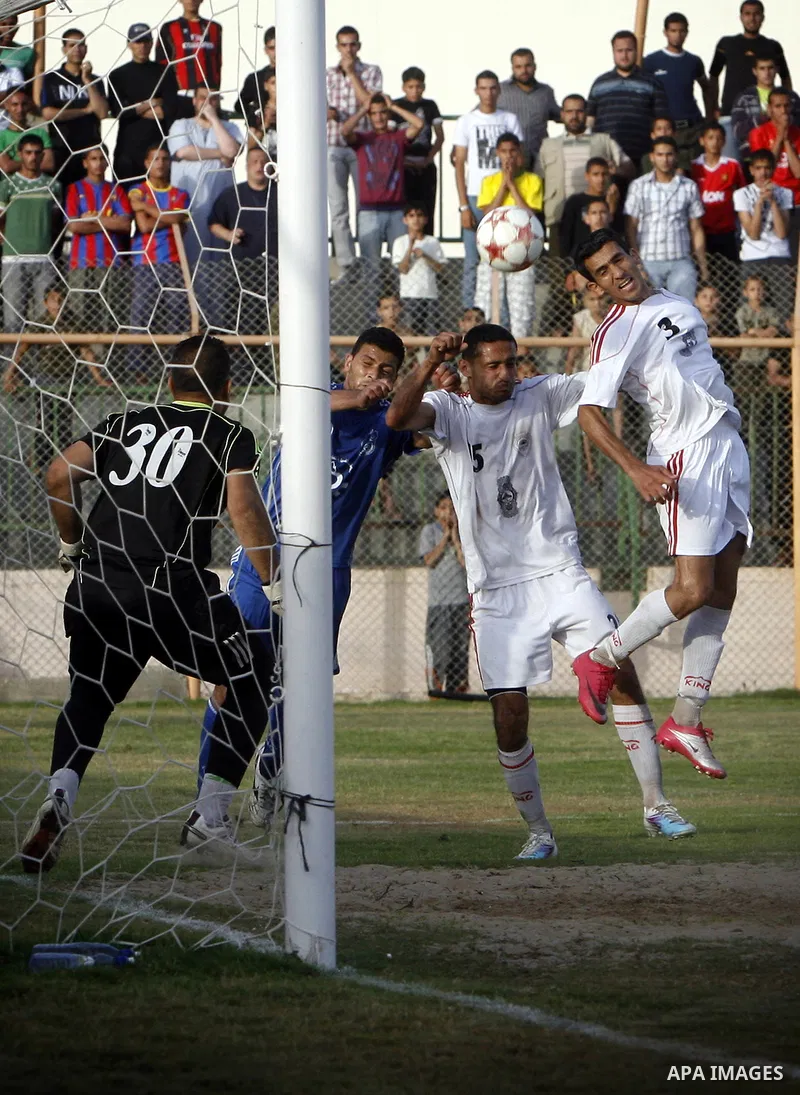 Palestinian Shabab Rafah player vies with Al-Shatea soccer club player during Gaza Strip league, in the southern Gaza Strip town Rafah on May 27,2011. The match ended 0-0.. Photo by Ali Jadallah