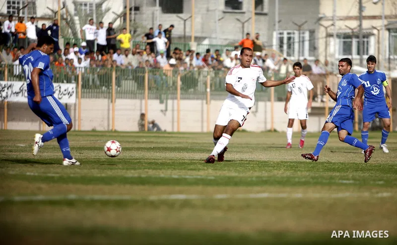 Palestinian Shabab Rafah player vies with Al-Shatea soccer club player during Gaza Strip league, in the southern Gaza Strip town Rafah on May 27,2011. The match ended 0-0.. Photo by Ali Jadallah