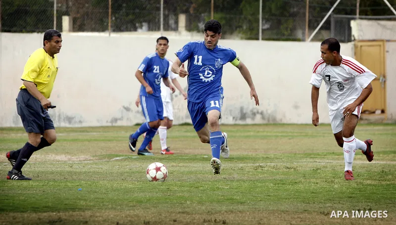 Palestinian Shabab Rafah player vies with Al-Shatea soccer club player during Gaza Strip league, in the southern Gaza Strip town Rafah on May 27,2011. The match ended 0-0.. Photo by Ali Jadallah