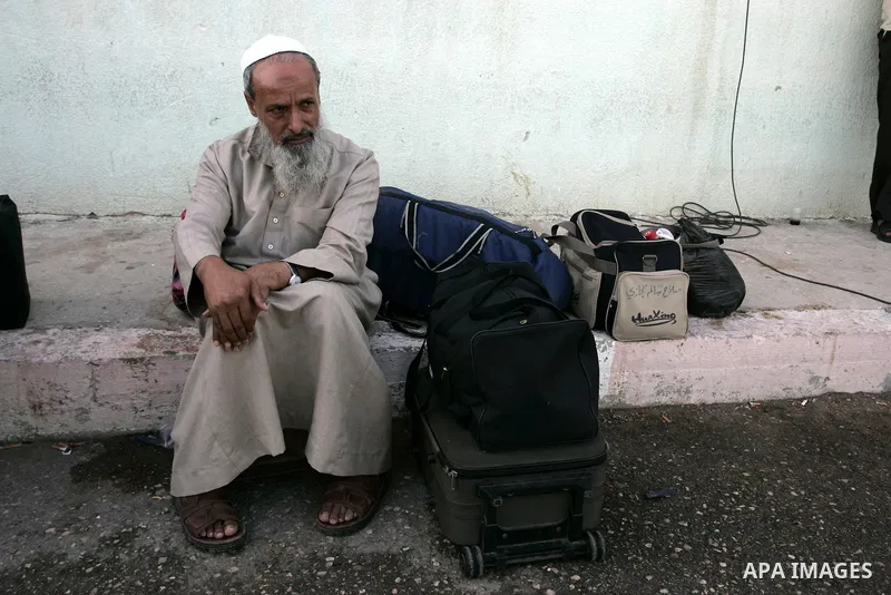 A Palestinian man waits to cross into Egypt through the Rafah border crossing in the southern Gaza Strip on May 28, 2011 as Egypt reopened the border, allowing people to cross freely for the first time in four years. Pho...
