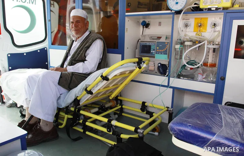 A Palestinian man sits in the ambulance waiting to cross into Egypt through the Rafah border crossing in the southern Gaza Strip on May 28, 2011 as Egypt reopened the border, allowing people to cross freely for the first...