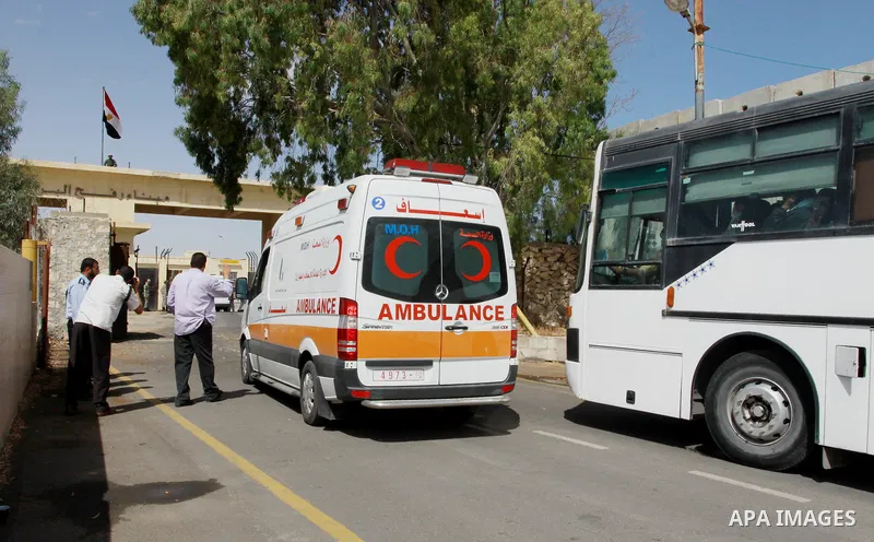 Palestinian ambulance waits to cross into Egypt through the Rafah border crossing in the southern Gaza Strip on May 28, 2011 as Egypt reopened the border, allowing people to cross freely for the first time in four years....