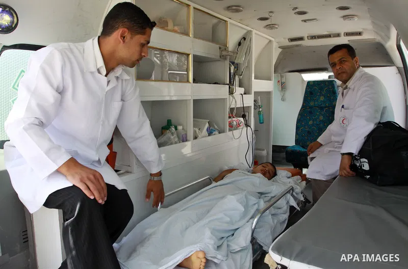 A Palestinian boy in the ambulance waits to cross into Egypt through the Rafah border crossing in the southern Gaza Strip on May 28, 2011 as Egypt reopened the border, allowing people to cross freely for the first time i...