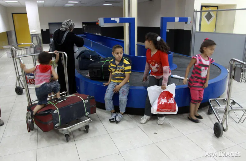 Palestinians returnees come through the Rafah border crossing in the southern Gaza Strip on May 28, 2011 as Egypt reopened the border, allowing people to cross freely for the first time in four years. Photo by Naaman Oma...