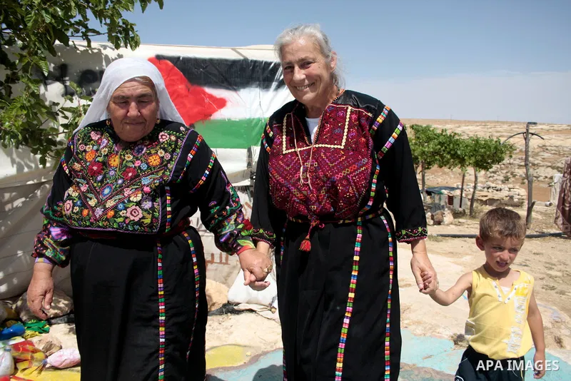 Palestinian, left-wing Israeli and foreign peace activists take part in the opening of the Susiya Creative and Learning Center in the mountains in the area of Yatta village close to the Jewish settlement of Sosia south o...
