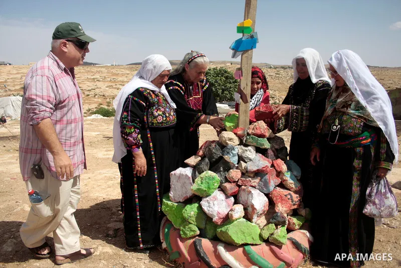 Palestinian, left-wing Israeli and foreign peace activists take part in the opening of the Susiya Creative and Learning Center in the mountains in the area of Yatta village close to the Jewish settlement of Sosia south o...