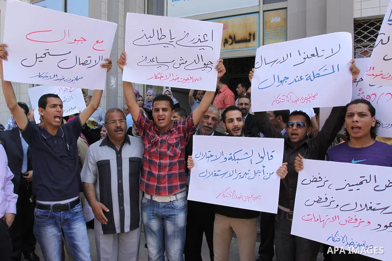 Palestinian Citizens protest in front of Jawwal company in Gaza City on May 30, 2011. demanding Jawwal to reduce prices and improve the communication service. Photo by Mohammed Asad