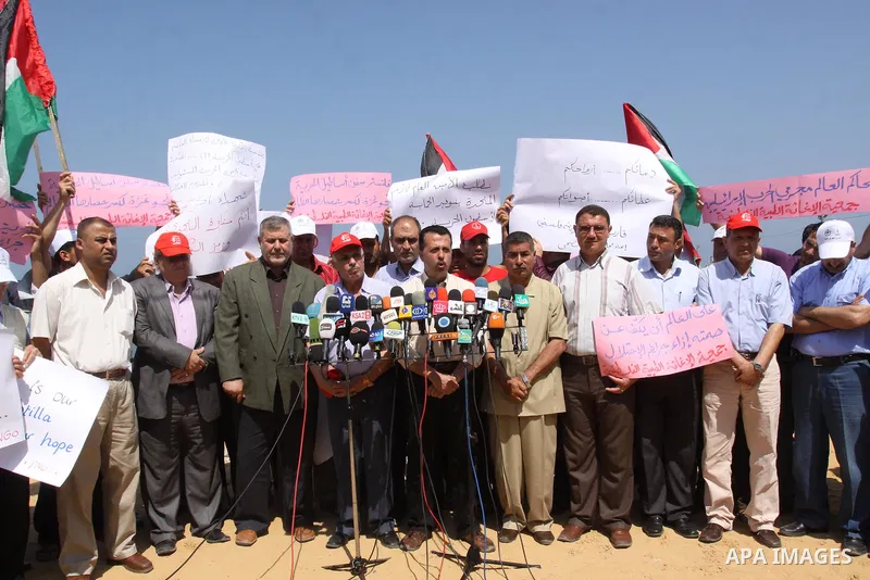NGO Network display a speach during a press conference off the coast of Gaza City May 30, 2011, during a rally marking the first anniversary of the death of nine Turks, who were shot dead last May when Israeli naval comm...