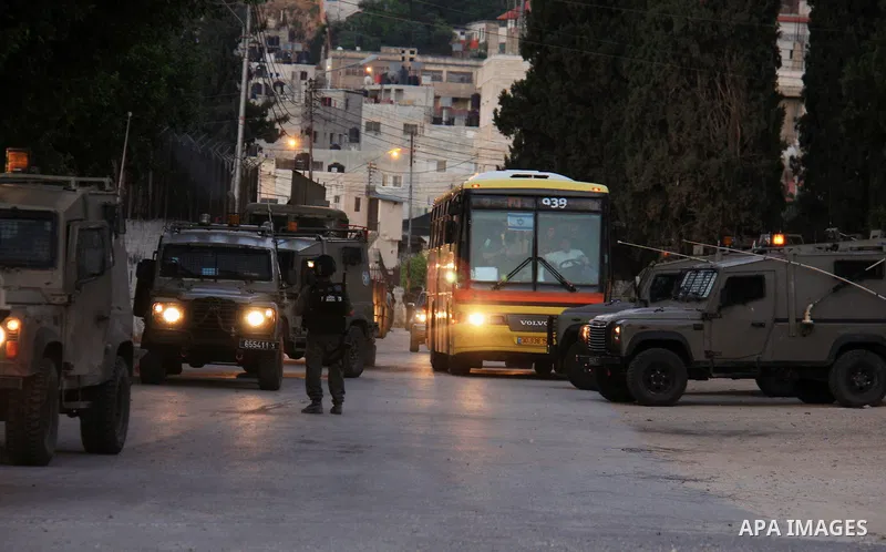 Israeli soldiers take a positions during clashes with Palestinians after Jews pray at the biblical Joseph's Tomb in the West Bank city of Nablus on May 30, 2011. Photo by Wagdi Eshtayah