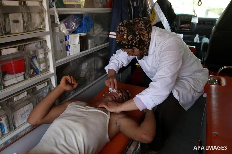 A Palestinian youth receives treatment after he wounded by Israeli soldiers, during clashes in the northern West Bank village of Iraq Burin, near Nablus, Monday, May 30, 2011. Photo by Wagdi Eshtayah