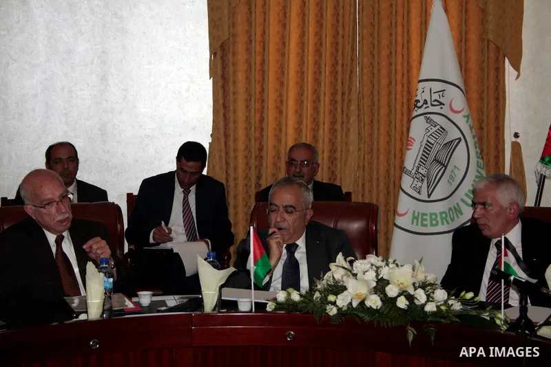 Palestinian prime minister Salam Fayyad attends the opening ceremony during the inauguration of Yasser Arafat Building at Hebron University in the Palestinian city of Hebron in the West Bank on May 30, 2011.Photo by Naje...